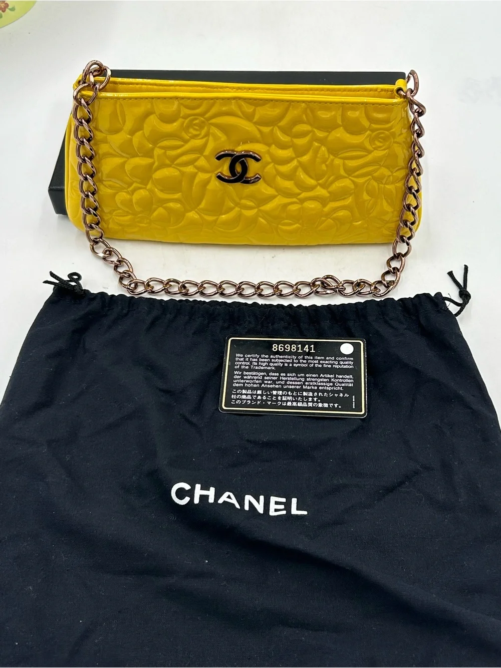 Women's Chanel patent leather floral embossed shoulder bag made in Italy